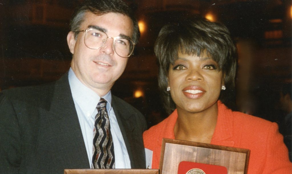 Reporter Robert Riggs and Oprah Winfrey Celebrate Together After Receiving George Peabody Awards at the 1995 Ceremony at Waldorf Astoria Hotel in New York City